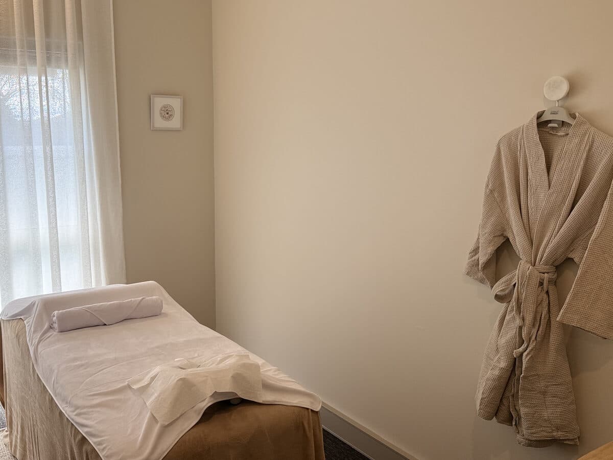 Soft window light over the massage table in a Fern & Soul treatment room in Innaloo